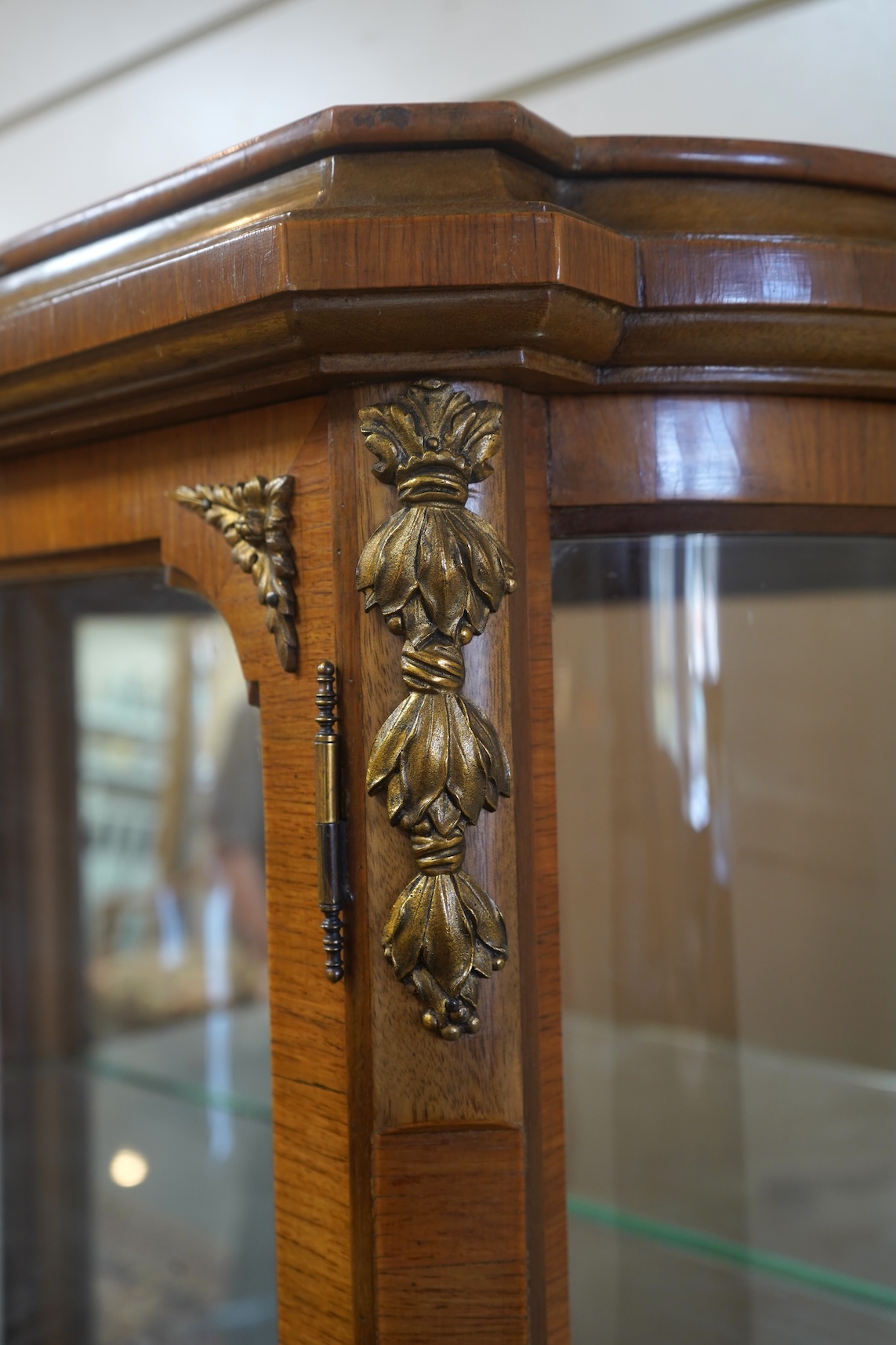 A Louis XVI style marquetry inlaid, gilt metal mounted kingwood vitrine
